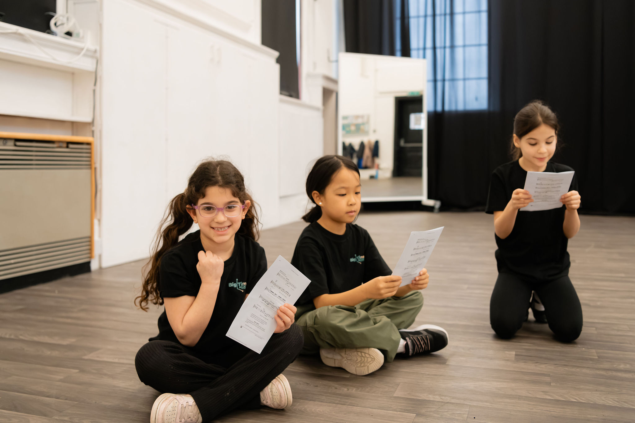 Young performer rehearsing with sheet music