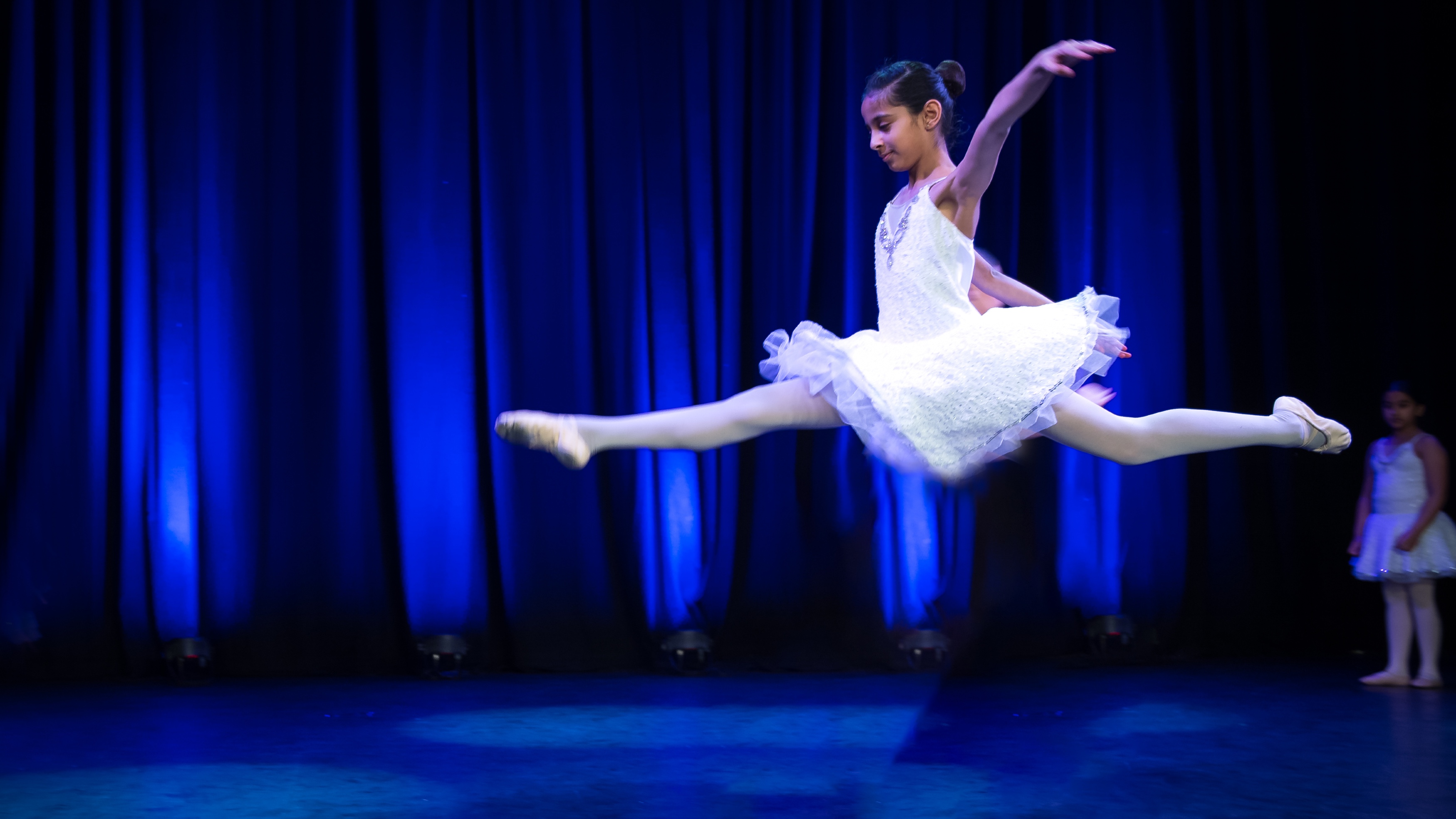Performer reaching toward the light